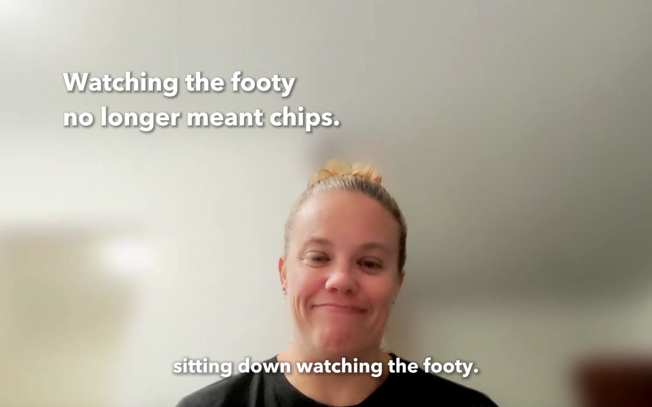 Interview still from Watching the footy no longer means eating chips